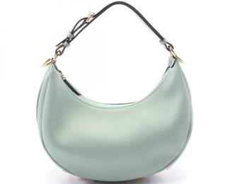 "This exquisite Fendi handbag is crafted from high-quality green leather, showcasing both elegance and functionality. The model number 8BR798 features a spacious design with dimensions of 28cm in width, 16.5cm in height, and a depth of 9cm, making it the perfect accessory for any occasion. The adjustable handle ranges from 23cm to 31cm, allowing for versatile carrying options. The handbag is adorned with gold-tone hardware and boasts a zippered interior for secure storage. It is in good pre-owned condition, offering a unique blend of style and sophistication.

Victorins Auctions will coordinate all domestic and international shipping. Please allow approximately 10–15 business days for processing. Certain items may require additional handling time depending on their location, origin, or special packaging requirements. By registering for or placing a bid in a Victorins auction, you confirm that you have reviewed, understood, and agreed to our Shipping, Payment, and Auction Policies."
