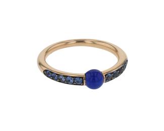"This exquisite Pomellato ring from the M'ama non M'ama collection features a stunning combination of ornamental stones, sapphires, and luxurious 18k rose gold. With a delicate design, the ring measures 0.5 cm in width and 0.4 cm in thickness, weighing 3 grams. The striking central lapis lazuli bead is beautifully complemented by smaller sapphires surrounding the band, creating a vibrant and elegant piece. Crafted with precision, this ring is a perfect statement accessory for any occasion. Note: resizing is not possible for this ring.

Victorins Auctions will coordinate all domestic and international shipping. Please allow approximately 10–15 business days for processing. Certain items may require additional handling time depending on their location, origin, or special packaging requirements. By registering for or placing a bid in a Victorins auction, you confirm that you have reviewed, understood, and agreed to our Shipping, Payment, and Auction Policies."
