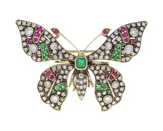 "This exquisite vintage butterfly brooch features a stunning combination of gemstones and fine craftsmanship. Made from 14K oxidized yellow gold, it showcases an asscher-cut emerald at its center, symbolizing beauty and grace. The wings are elegantly adorned with shimmering diamonds, vibrant emeralds, and rich rubies, making it a striking piece. With a width of 34 mm and a length of 49 mm, this brooch is not only a beautiful accessory but also a collectible treasure that will be cherished for years to come.

Victorins Auctions will coordinate all domestic and international shipping. Please allow approximately 10–15 business days for processing. Certain items may require additional handling time depending on their location, origin, or special packaging requirements. By registering for or placing a bid in a Victorins auction, you confirm that you have reviewed, understood, and agreed to our Shipping, Payment, and Auction Policies."
