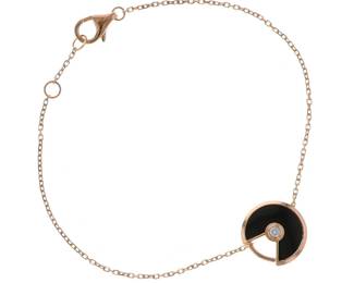 "Discover the exquisite Cartier Amulette XS bracelet, a perfect blend of luxury and elegance. Crafted from 18k rose gold, this delicate bracelet features a stunning circular pendant adorned with onyx and a sparkling diamond centerpiece. With a width of 1.2 cm and adjustable lengths from 15 to 16 cm, it ensures a comfortable fit for any wrist. Weighing only 2 g, this modern piece showcases the iconic artistry of Cartier, perfect for any special occasion or as a chic daily accessory.

Victorins Auctions will coordinate all domestic and international shipping. Please allow approximately 10–15 business days for processing. Certain items may require additional handling time depending on their location, origin, or special packaging requirements. By registering for or placing a bid in a Victorins auction, you confirm that you have reviewed, understood, and agreed to our Shipping, Payment, and Auction Policies."
