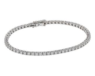 "This stunning diamond tennis bracelet blends elegance with luxury. Crafted from 18k white gold, this piece is set with sparkling diamonds totaling 2.77 carats. Designed for comfort and style, the bracelet measures 17.5 cm in length and 0.3 cm in width, making it a perfect accessory for any occasion. Weighing 9.9 grams, it offers a beautiful shine and a modern aesthetic that complements both casual and formal outfits.

Victorins Auctions will coordinate all domestic and international shipping. Please allow approximately 10–15 business days for processing. Certain items may require additional handling time depending on their location, origin, or special packaging requirements. By registering for or placing a bid in a Victorins auction, you confirm that you have reviewed, understood, and agreed to our Shipping, Payment, and Auction Policies."
