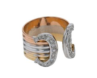 "This exquisite Cartier Double C ring showcases a captivating design crafted from three tones of 18k gold: rose, white, and yellow. Adorned with sparkling diamonds totaling 0.25 ct, this vintage piece is not just a ring, but a statement of elegance and style. With a width of 1.3 cm and a thickness of 0.2 cm, it has a weight of 5.5 g, making it a comfortable yet luxurious addition to any jewelry collection. This timeless item features a unique dual C motif, perfect for those who appreciate fine craftsmanship.

Victorins Auctions will coordinate all domestic and international shipping. Please allow approximately 10–15 business days for processing. Certain items may require additional handling time depending on their location, origin, or special packaging requirements. By registering for or placing a bid in a Victorins auction, you confirm that you have reviewed, understood, and agreed to our Shipping, Payment, and Auction Policies."
