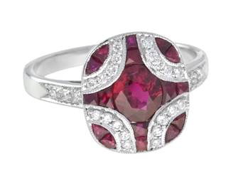 "This stunning Art Deco-inspired ring features a captivating oval ruby at its center, surrounded by an intricate arrangement of French trapezoid cut rubies and sparkling round diamonds. With a total ruby weight of 1.92 carats, the striking red and pink hues of the gems are elegantly complemented by 0.19 carats of diamonds. The ring weighs approximately 5.4 grams, making it a comfortable and stylish addition to any jewelry collection. Its unique design and quality materials offer both timeless elegance and modern flair.

Victorins Auctions will coordinate all domestic and international shipping. Please allow approximately 10–15 business days for processing. Certain items may require additional handling time depending on their location, origin, or special packaging requirements. By registering for or placing a bid in a Victorins auction, you confirm that you have reviewed, understood, and agreed to our Shipping, Payment, and Auction Policies."
