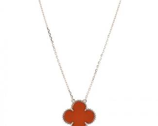 "This exceptional Van Cleef & Arpels Magic Alhambra pendant necklace features an exquisite clover motif crafted from luminous red carnelian. As part of the Prince Edition collection, this piece is made from solid 18K yellow gold, showcasing a timeless design that radiates elegance and good fortune. The intricate beaded gold contour enhances the rich color of the gemstone, making it a stunning accessory for any occasion. Included with the necklace is the original branded presentation box, perfect for gifting or safekeeping.

Victorins Auctions will coordinate all domestic and international shipping. Please allow approximately 10–15 business days for processing. Certain items may require additional handling time depending on their location, origin, or special packaging requirements. By registering for or placing a bid in a Victorins auction, you confirm that you have reviewed, understood, and agreed to our Shipping, Payment, and Auction Policies."
