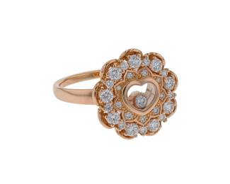 "This stunning Chopard Happy Diamonds ring exudes luxury and elegance. Crafted from 18k rose gold, this modern masterpiece features a heart-shaped design at the center, embellished with brilliant diamonds. The ring boasts a total diamond weight of 0.74 carats, creating a captivating sparkle. With a size of 58 and dimensions of 1.7 cm by 1.7 cm, it fits comfortably on any finger. Ideal for special occasions or as a luxurious gift, this exquisite piece of jewelry perfectly captures the essence of refined craftsmanship and sophisticated style.

Victorins Auctions will coordinate all domestic and international shipping. Please allow approximately 10–15 business days for processing. Certain items may require additional handling time depending on their location, origin, or special packaging requirements. By registering for or placing a bid in a Victorins auction, you confirm that you have reviewed, understood, and agreed to our Shipping, Payment, and Auction Policies."

