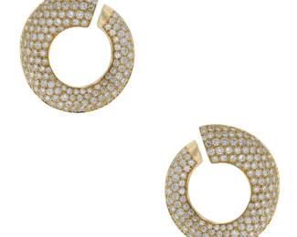 "This exquisite pair of earrings features a stunning design crafted from luxurious 18K yellow gold, delicately adorned with sparkling diamonds. The modern, open circular shape offers a captivating elegance suitable for any occasion. Each earring measures 3.1 cm in length and 2.8 cm in width, with a thickness of 1.1 cm and a total weight of 18.7 grams. The diamonds are of high quality, with a combined weight of 5 carats. These earrings are perfect for adding a touch of sophistication to your jewelry collection.

Victorins Auctions will coordinate all domestic and international shipping. Please allow approximately 10–15 business days for processing. Certain items may require additional handling time depending on their location, origin, or special packaging requirements. By registering for or placing a bid in a Victorins auction, you confirm that you have reviewed, understood, and agreed to our Shipping, Payment, and Auction Policies."
