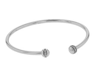 "This exquisite Piaget Possession bracelet showcases a stunning design crafted from 18k white gold and adorned with brilliant diamonds. With a sleek width of 0.6 cm and a comfortable length of 15 cm, this modern piece weighs 6.6 grams, making it a perfect accessory for any occasion. The subtle elegance of the diamonds, totaling 0.2 carats, adds a touch of luxury to this open-ended cuff bracelet. Ideal for collectors and enthusiasts alike, this bracelet offers timeless beauty and sophisticated style.

Victorins Auctions will coordinate all domestic and international shipping. Please allow approximately 10–15 business days for processing. Certain items may require additional handling time depending on their location, origin, or special packaging requirements. By registering for or placing a bid in a Victorins auction, you confirm that you have reviewed, understood, and agreed to our Shipping, Payment, and Auction Policies."
