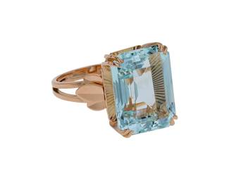 "This exquisite vintage ring showcases a stunning large rectangular aquamarine gemstone, weighing approximately 12 carats. Crafted from 18k yellow gold, the ring combines elegance with artistry. The aquamarine is set in a secure prong setting, allowing light to enhance its brilliant color. The ring's sides feature decorative details that add to its charm and uniqueness. With dimensions of 1.6 cm in length and 1.2 cm in width, this piece is both substantial and stylish, making it a perfect addition to any jewelry collection.

Victorins Auctions will coordinate all domestic and international shipping. Please allow approximately 10–15 business days for processing. Certain items may require additional handling time depending on their location, origin, or special packaging requirements. By registering for or placing a bid in a Victorins auction, you confirm that you have reviewed, understood, and agreed to our Shipping, Payment, and Auction Policies."
