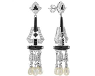 "Discover the elegance of these Art Deco inspired earrings, masterfully crafted in luxurious 14K white gold. Adorned with exquisite black onyx and shimmering diamonds, these stunning drops culminate in lustrous natural pearls. With a vintage style and a chic geometric design, they embody sophistication and glamour. Each earring features multiple diamonds, creating a captivating interplay of light and texture. Perfect for special occasions or as a statement piece, these earrings are sure to impress anyone who appreciates fine jewelry.

Victorins Auctions will coordinate all domestic and international shipping. Please allow approximately 10–15 business days for processing. Certain items may require additional handling time depending on their location, origin, or special packaging requirements. By registering for or placing a bid in a Victorins auction, you confirm that you have reviewed, understood, and agreed to our Shipping, Payment, and Auction Policies."
