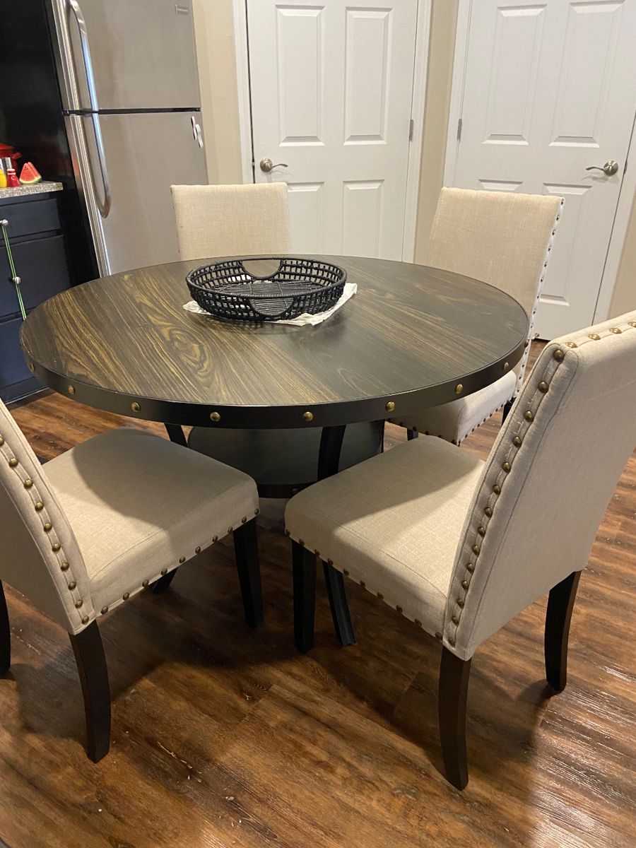 48” Round dinette table with nailhead trim and four upholstered chairs