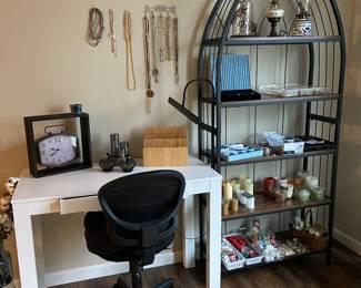 Nice craft table, chair and light.  Small collection of jewelry including some sterling necklaces.  Candle collection and various home decor items.  And don't forget to check out that great shelving unit.