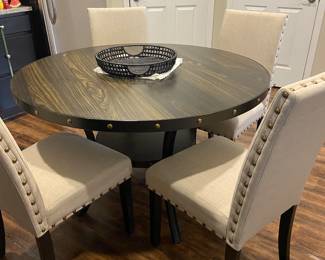 48” Round dinette table with nailhead trim and four upholstered chairs