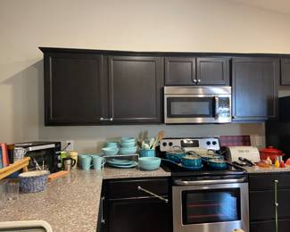 Several pots/pans and skillets, dishes, glassware and a pantry full of misc. items  