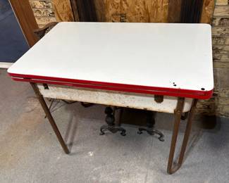 VINTAGE MCM PORCELAIN TOP TABLE WITH SLIDE OUT LEAVES.