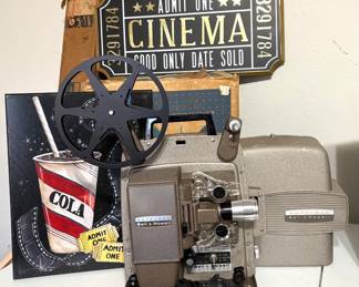 VINTAGE AUTOLOAD BELL & HOWELL 8MM MOVIE PROJECTOR AND FUN MOVIE DECOR.
