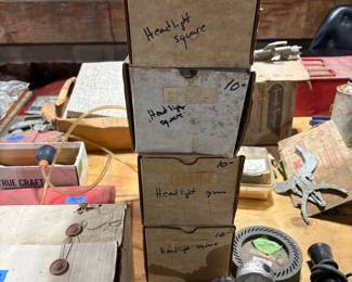 OLD SCHOOL NEW IN BOX GLASS HEADLIGHTS.