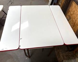 VINTAGE MCM PORCELAIN TOP TABLE WITH SLIDE OUT LEAVES.