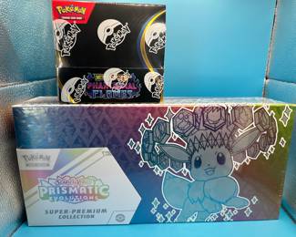 Phantasmal Flames Booster & Prismatic Evolutions SPC Available for Raffle. 10.00 gets you a chance for an over 500.00 prize.