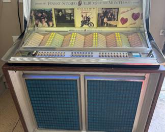 
AI Overview


Seeburg LPC-1 jukebox. 
 "LPC-1" stands for "Low Profile Console" or "Long Play Console". 
It was introduced around 1961-1963 and was one of the first stereo jukeboxes
160 SELECTIONS
Model: LPC-1
Serial: 115196
