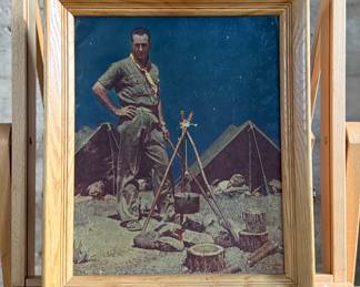 "The Scoutmaster", a vintage print on canvas by listed artist, Norman Rockwell. Professionally framed, this piece was painted in 1956 and depicts a Scoutmaster standing by a campfire at night, with four scouts asleep in tents in the background. This piece measures in frame, 18.5” H x 16” W. Rockwell created the painting as a tribute to American Scoutmasters, capturing a moment of quiet leadership and service.
