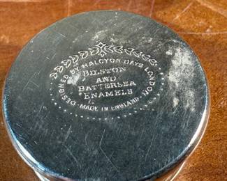 This lot features a porcelain figurine titled, "Cat and Mouse", manufactured by Lladro (model number 5236) & a cat themed trinket box manufactured by Bilston and Battersea. Bilston and Battersea enamels are fine English enamelware, originally produced in the 18th century and revived in the 20th century, known for decorative items like trinket boxes, pillboxes, and other luxury goods
