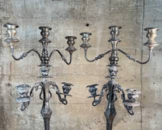 This lot features a pair of antique French Louis XVI style candelabras. Each one measures, 25” H x 16” W x 7” D.
