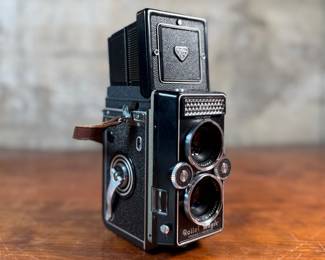 The lot features a Rollei Magic twin-lens reflex (TLR) camera. This vintage medium format camera was produced by the German company Franke & Heidecke between 1960 and 1962. It uses 120 film and produces 6×6 cm images. The camera features a 75mm f/3.5 Schneider Xenar taking lens and a 75mm f/3.5 Heidosmat viewing lens. A key feature of the Rollei Magic is its automatic exposure system, which relies on a built-in selenium light meter. The camera’s design is based on the Rolleicord series and was an early attempt at an automatic camera in the medium format market. Tested and in good working condition.
