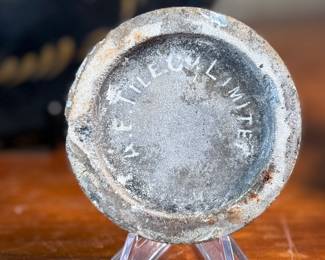 This lot features a collection of antiques and collectibles including sculpture, brass candlesticks, a Zwaro pottery vase, and more.
