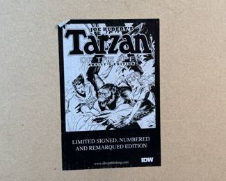 This lot features a publisher’s proof of Joe Kubert’s Tarzan of the Apes Artist’s Edition from IDW Publishing. These books were put out as a limited edition, signed, and mnumbered remarqued edition of the graphic novel. This one in particular is an unsigned publisher’s proof in the original box, in excellent condition. A rare find!
