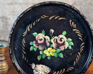 This lot features a collection of antiques and collectibles including sculpture, brass candlesticks, a Zwaro pottery vase, and more.
