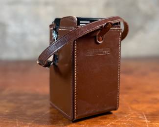 The lot features a Rollei Magic twin-lens reflex (TLR) camera. This vintage medium format camera was produced by the German company Franke & Heidecke between 1960 and 1962. It uses 120 film and produces 6×6 cm images. The camera features a 75mm f/3.5 Schneider Xenar taking lens and a 75mm f/3.5 Heidosmat viewing lens. A key feature of the Rollei Magic is its automatic exposure system, which relies on a built-in selenium light meter. The camera’s design is based on the Rolleicord series and was an early attempt at an automatic camera in the medium format market. Tested and in good working condition.
