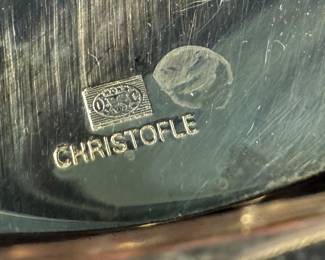 This lot features a stunning set of flatware by Christofle for Neiman Marcus. Each piece is beautifully marked as shown in photos, accompanied with Neiman Marcus covers, and housed in a vintage flatware box for safe storage. Christofle was founded in Paris in 1830 by Charles Christofle, who gained a reputation for his innovative silver plating technology and became a purveyor to the French court. The company grew significantly, supplying its flatware to royalty and even making its mark at international exhibitions, earning awards until at least 1937. Key moments in its history include acquiring the patents for electroplating in 1842, creating the America flatware collection in 1933, and introducing the Aria collection in 1985. 
This set includes two (2) large spoons, one (1) server, one (1) large fork, three (3) knives, twelve (12) big spoons, twelves (12) big forks, twelve (12) standard spoons, and eight (8) standard forks.