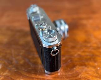 The lot features a vintage Nikon S rangefinder camera with a Nikkor-S 5cm f/1.4 lens. The Nikon S was the first Nikon camera to be imported to the US market. Tested and in good working condition.
