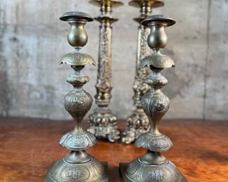 This lot features a collection of six (6) antique brass candlesticks. Three matching pairs with the tallest measuring, 17” H.
