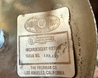 This lot features a pair of mid-century modern style brass pendant lights, manufactured by The Feldman Company, circa 1970s. Each one measures, 13” H x 16” W x 16” D.
