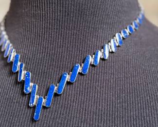 This lot features a stunning silver Lapis graduated necklace and earring set, circa 1960s. Marked .970 silver as shown in photos with a total approx. weight of 42.14 grams. The necklace measures 18” and comes in a nice presentation box.

