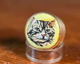 This lot features a porcelain figurine titled, "Cat and Mouse", manufactured by Lladro (model number 5236) & a cat themed trinket box manufactured by Bilston and Battersea. Bilston and Battersea enamels are fine English enamelware, originally produced in the 18th century and revived in the 20th century, known for decorative items like trinket boxes, pillboxes, and other luxury goods
