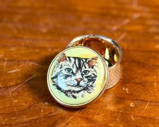 This lot features a porcelain figurine titled, "Cat and Mouse", manufactured by Lladro (model number 5236) & a cat themed trinket box manufactured by Bilston and Battersea. Bilston and Battersea enamels are fine English enamelware, originally produced in the 18th century and revived in the 20th century, known for decorative items like trinket boxes, pillboxes, and other luxury goods
