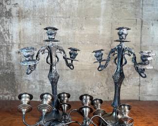 This lot features a pair of antique French Louis XVI style candelabras. Each one measures, 25” H x 16” W x 7” D.
