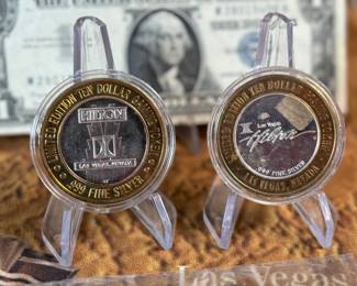 The Las Vegas lot! This lot features two coins featuring .999 fine silver, a bag of proof nickels, a new sealed card set, three (3) silver certificates, and a Baccarat table cover from The Hilton in Las Vegas.
