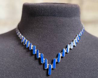This lot features a stunning silver Lapis graduated necklace and earring set, circa 1960s. Marked .970 silver as shown in photos with a total approx. weight of 42.14 grams. The necklace measures 18” and comes in a nice presentation box.
