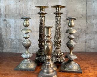 This lot features a collection of six (6) antique brass candlesticks. Three matching pairs with the tallest measuring, 17” H.
