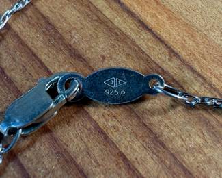 This lot features a stunning necklace and pendant by Judith Jack with a total approx. weight of 3.00 grams and measures, 17”. Marked on pendant and clasp as shown in photos. Judith and Jack Rosenberg founded the jewelry maker in 1969. In 2001, the company was sold to the Jones Group and hasn’t been an active brand since. During its heyday, Judith Jack was best known for its sterling silver marcasite jewelry inspired by the Art Deco and Art Nouveau styles.
