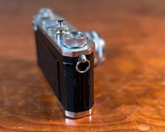 The lot features a vintage Nikon S rangefinder camera with a Nikkor-S 5cm f/1.4 lens. The Nikon S was the first Nikon camera to be imported to the US market. Tested and in good working condition.
