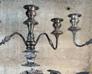 This lot features a pair of antique French Louis XVI style candelabras. Each one measures, 25” H x 16” W x 7” D.
