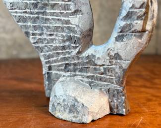 This lot features a stunning polished fossil sculpture featuring embedded ammonite and orthoceras fossils. This sculpture measures, 17.5” H x 12” W x 4” D.
