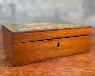 This lot features an antique wooden homeopathic apothecary box used to store various vials of homeopathic remedies. This box measures, 2.75” H x 7.75” W x 5” D.
