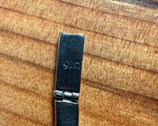 This lot features a vintage silver lapis modernist set including a hinged bib necklace, a bracelet, and earrings. Marked .970 silver with a total approx. weight of 51.89 grams. The necklace measures 16”, bracelet 8”, and earrings 1.5” H.
