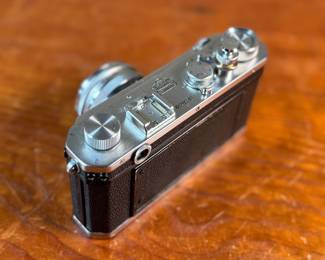 The lot features a vintage Nikon S rangefinder camera with a Nikkor-S 5cm f/1.4 lens. The Nikon S was the first Nikon camera to be imported to the US market. Tested and in good working condition.
