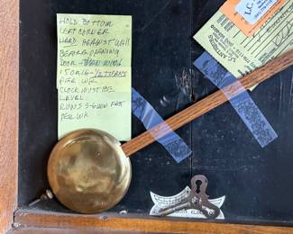 This lot features an antique clock made by the Waterbury Clock Company, with an advertising glass panel for Macdonald Jewelry Company. Appears complete with key, pendulum, instructions, and service records. This clock measures, 35” H x 16” W x 5” D. The Waterbury Clock Company factory is a historic complex of factory buildings in Waterbury, Connecticut. Development began in 1873, with the extensive plant serving as the company’s main manufacturing facility and headquarters until 1944.
